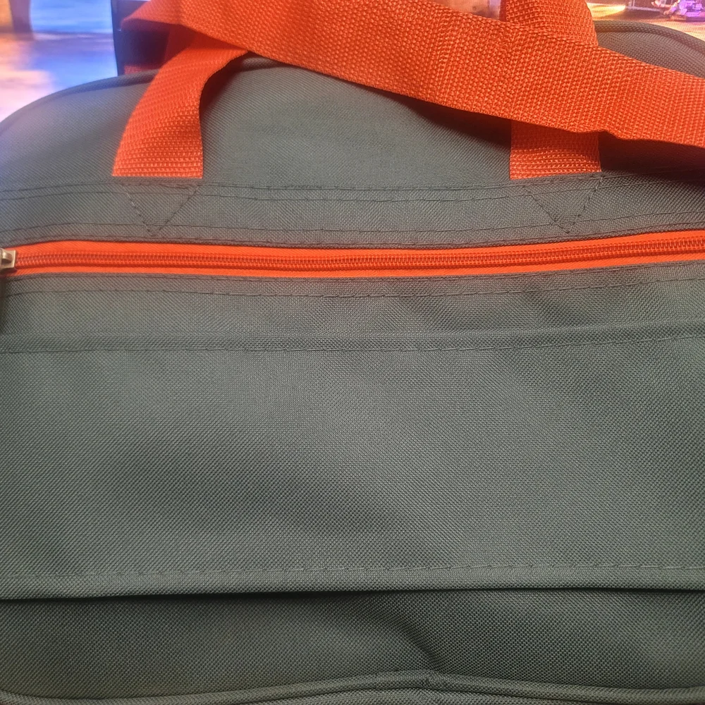 Vibrant Green and Orange Travel Bags for Adventurers